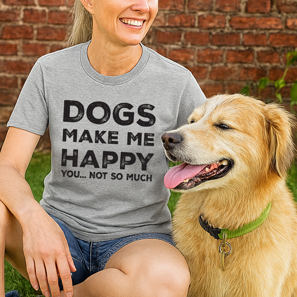 Person wearing a gray t-shirt with 'DOGS MAKE ME HAPPY YOU... NOT SO MUCH' text, sitting next to a golden dog outdoors.
