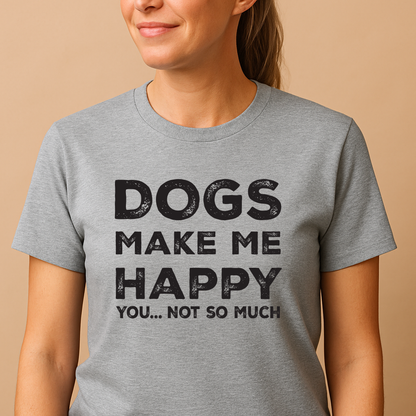 Person wearing a gray t-shirt with 'DOGS MAKE ME HAPPY YOU... NOT SO MUCH' text on a beige background
