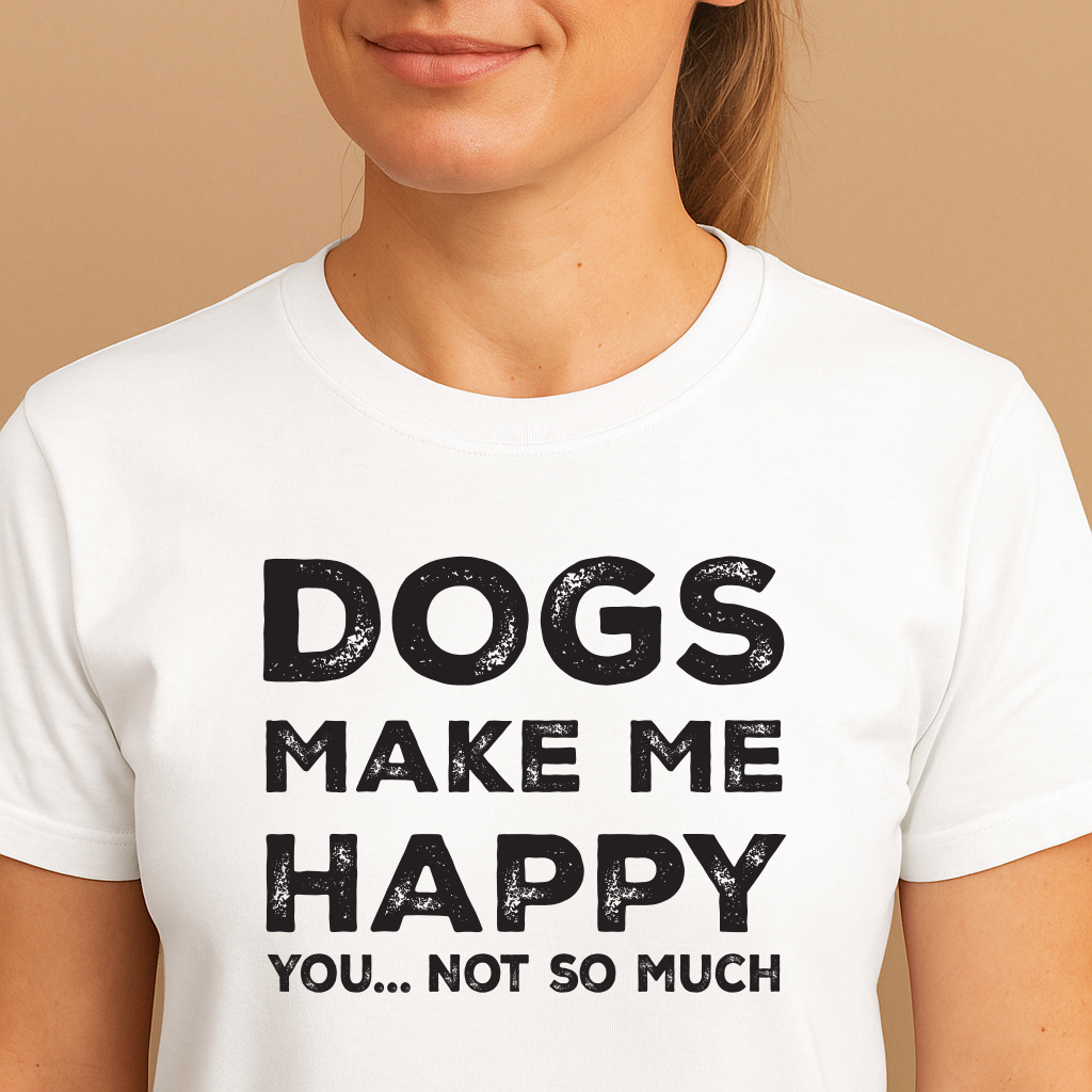 Person wearing a white t-shirt with 'DOGS MAKE ME HAPPY YOU... NOT SO MUCH' text on a beige background