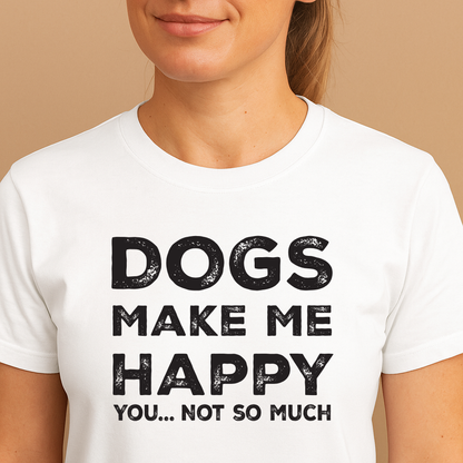 Person wearing a white t-shirt with 'DOGS MAKE ME HAPPY YOU... NOT SO MUCH' text on a beige background